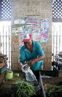 A trader in Mombasa, Kenya. Critics of East African economic integration say that Kenya is likely to reap the majority of the benefits. A trader in Mombasa, Kenya. Critics of East African economic integration say that Kenya is likely to reap the majority of the benefits.