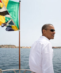 In this picture, taken yesterday, President Barack Obama stands on the bow of the ferry to Gorée Island, Senegal.