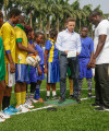 How players are powering a Lagos football pitch one step at a time Laurence Kemball-Cook showing R&B star Akon and football players in Lagos how Pavegen's kinetic energy tiles work. Photo by Edelman PR