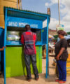 How this money transfer company plans to compete in Africa Zoona Customer uses booth in Lusaka, Zambia 200x240
