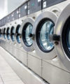 Five companies using technology to deliver greater convenience to Kenyans A row of industrial washing machines in a public laundromat.